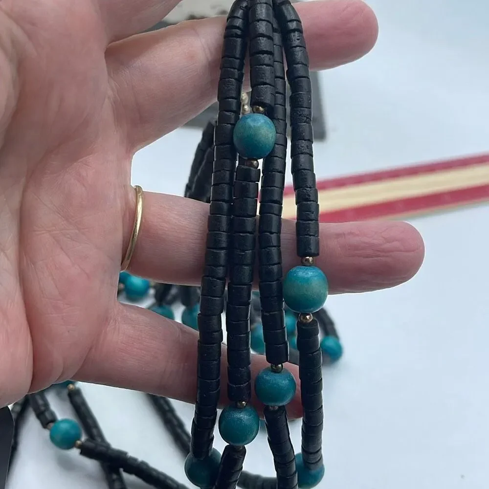 Vintage 4 strand wooden beaded boho festival necklace.